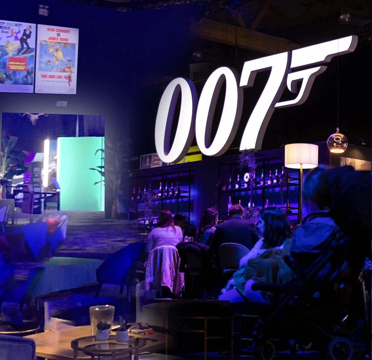 A vibrant '007' neon sign illuminating the themed lounge area at the 'Bond in Motion' exhibition, enhancing the ambiance