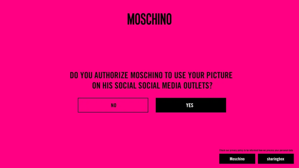 Coinvolgimento dei social media con Moschino - Autorizzate Moschino a pubblicare le vostre immagini di photobooth sui social media con un semplice tocco, secondo le linee guida GDPR.