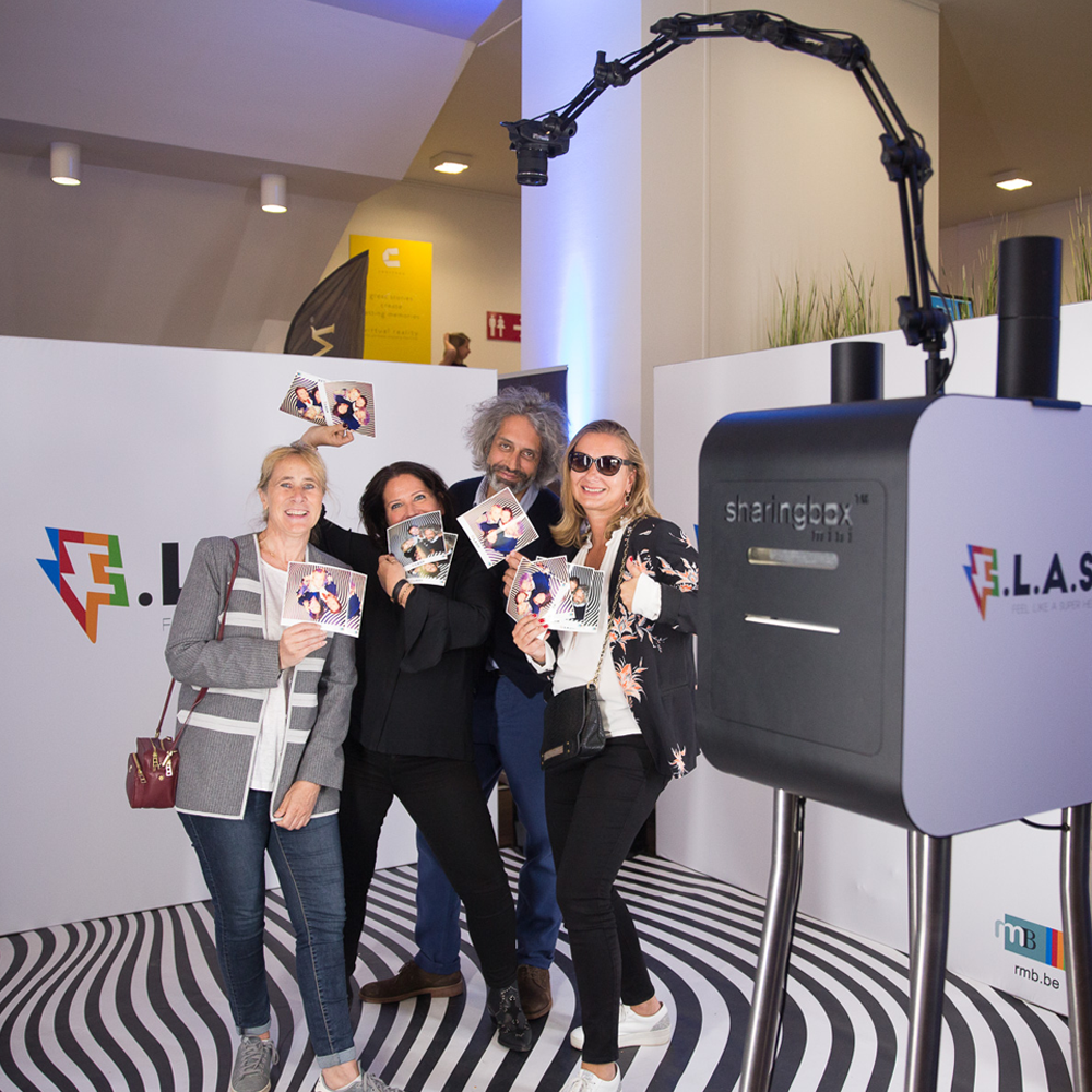 People in front of giraffe photobooth during FLASH event
