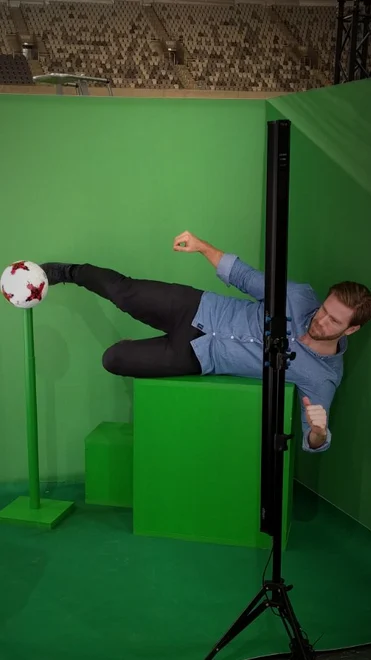 Green screen man shooting ball