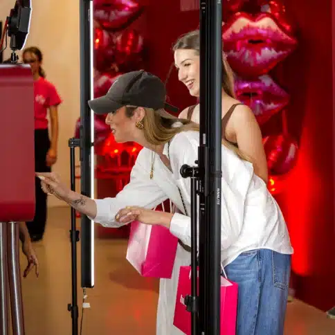 Guests posing in an immersive kaleidoscope photo booth